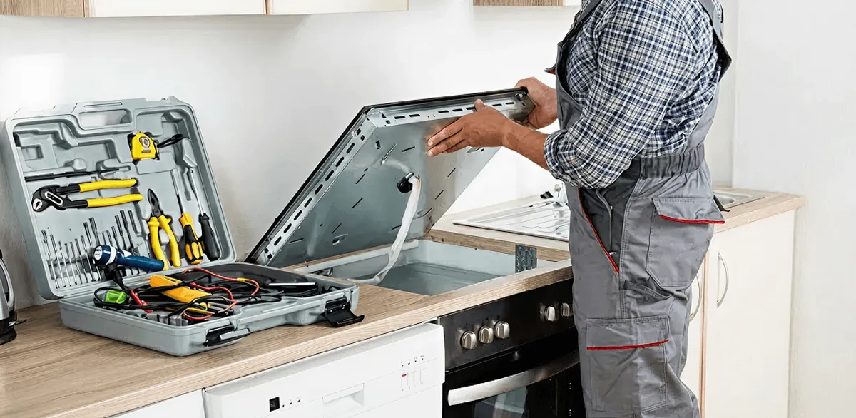 Handyman repairing a cooktop and checking wiring connections in Charleston, SC